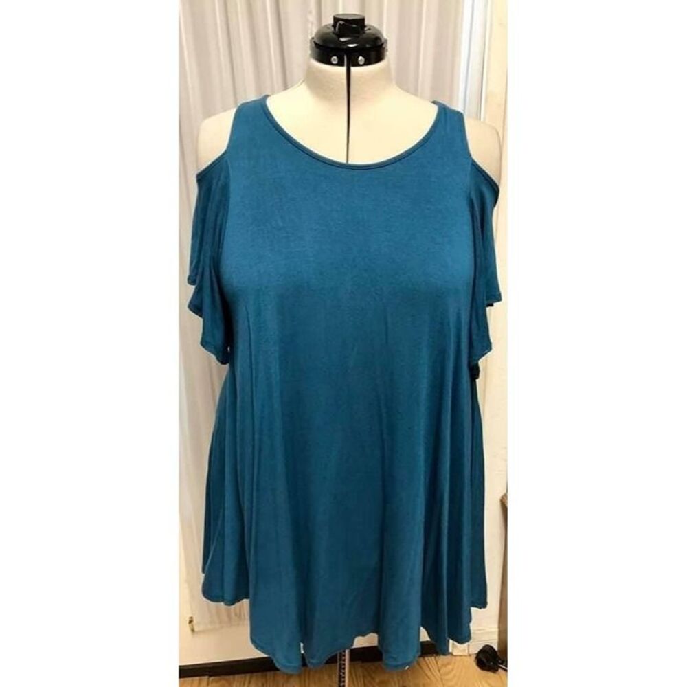 Super Nova teal cold shoulder tunic. Size large. Runs oversize.